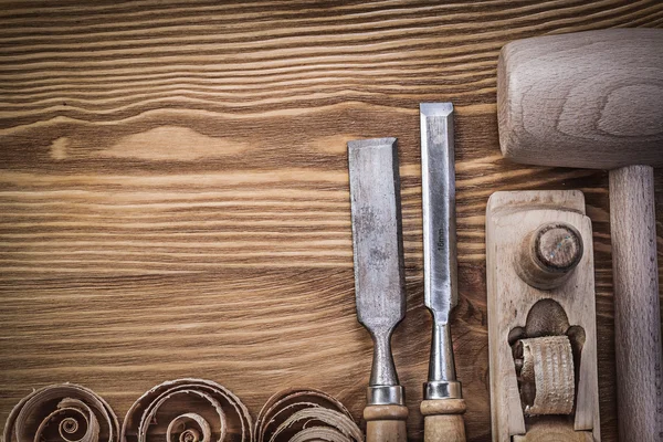 Wooden hammer planer on board — Stock Photo, Image