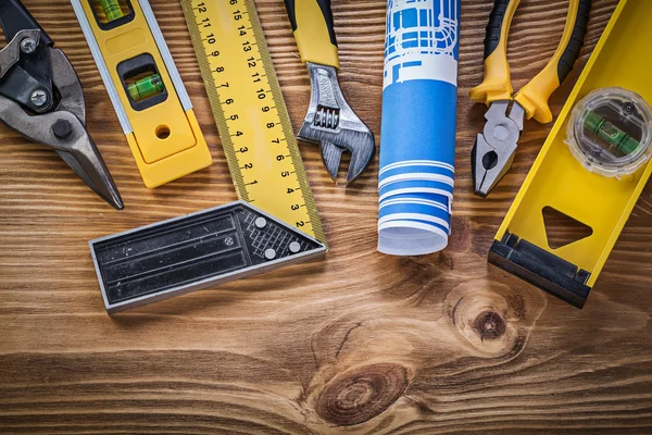 Assortment of construction tools on vintage wooden board directl — Stock Photo, Image