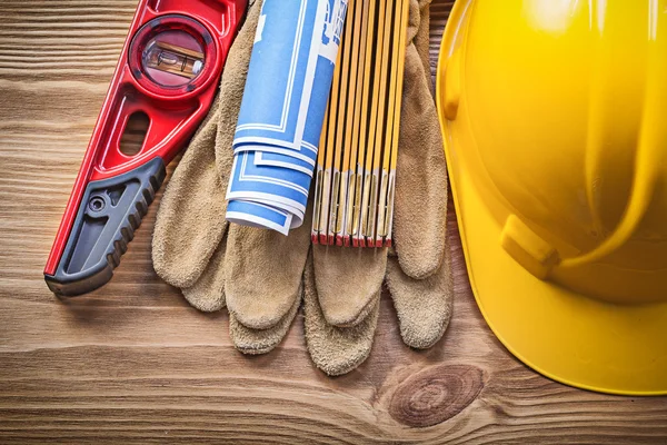 Hard hat safety gloves construction level blue engineering drawi — Stock Photo, Image