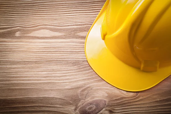 Protective building helmet on wooden board construction concept — Stock Photo, Image