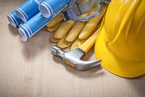 Säkerhet arbetskläder ritningar klo hammare på träplatta konstruktion — Stockfoto