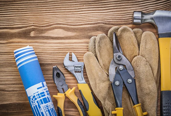 Blueprint protective gloves claw hammer pliers tin snips adjusta — Stock Photo, Image