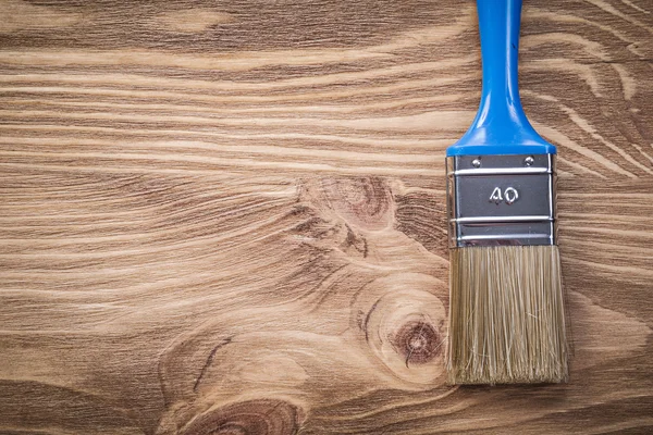 Paintbrush on wooden board copy space construction concept — Stock Photo, Image