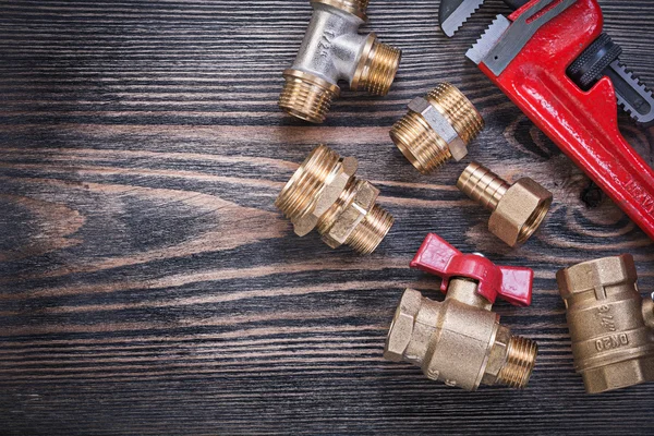 Assortment of adjustable monkey wrench brass fittings water valv — Stock Photo, Image