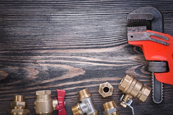 Composition of plumbers equipment on wooden board plumbing conce — Stock Photo, Image