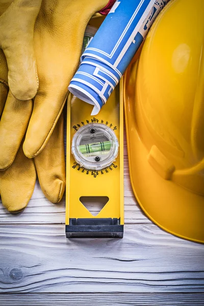 Par sikkerhedshandsker bygning hjelm blå tegninger constructi - Stock-foto