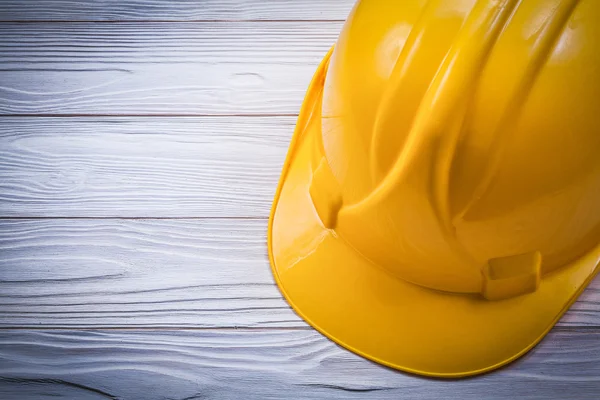 Protective hard hat on wooden board construction concept — Stock Photo, Image