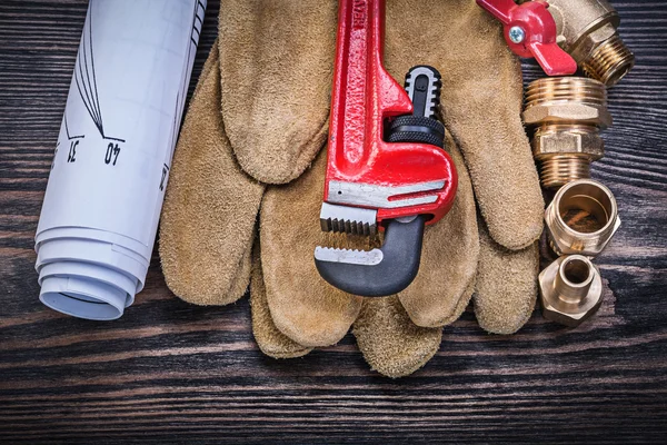 Protective gloves monkey wrench construction drawings brass plum — Stock Photo, Image