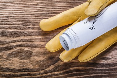 Ahşap tahta anate haddelenmiş inşaat çizimleri güvenlik eldiveni