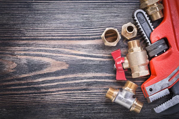 Copy space of brass plumbing equipment on wooden board construct — Stock Photo, Image