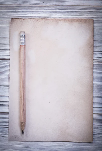 Vintage paper sheet pencil on wooden board top view — Stock Photo, Image