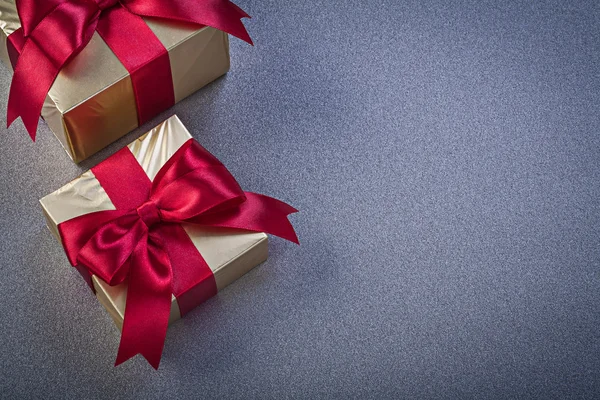 Wrapped giftboxes on grey background copy space holidays concept — Stock Photo, Image