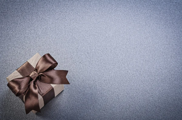 Present box with brown tape on grey background copy space celebr — Stock Photo, Image