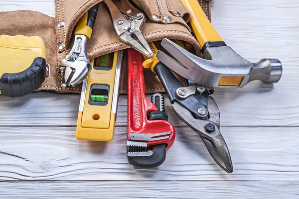 Tool belt pliers construction level tape line claw hammer pipe w — Stock Photo, Image