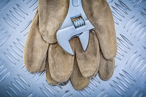 Leather safety gloves stainless monkey spanner on corrugated met — Stock Photo, Image