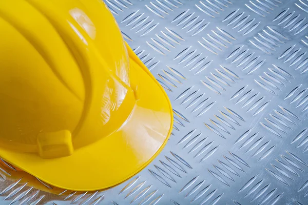 Protective building helmet on channeled metal background constru — Stock Photo, Image