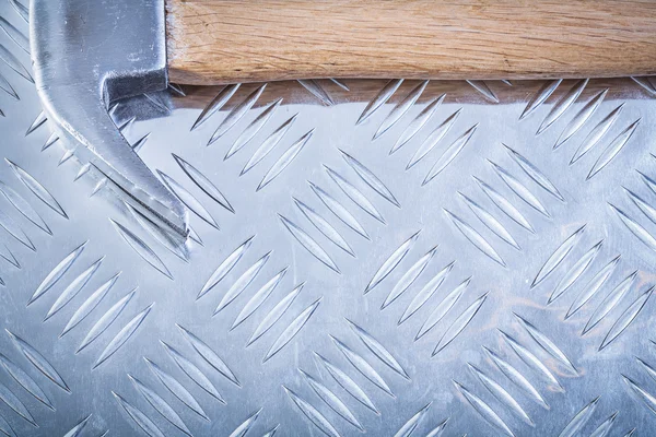 Claw hammer on channeled metal sheet horizontal version construc — Stock Photo, Image