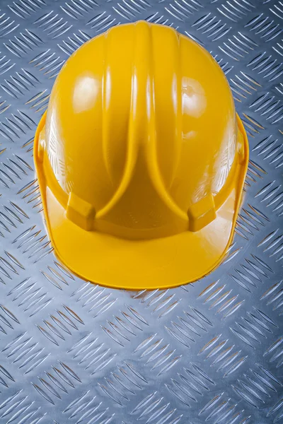 Building helmet on fluted metal background construction concept — Stock Photo, Image