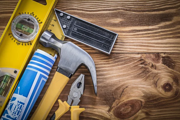 Construction level, ruler, hammer and pliers — Stock Photo, Image
