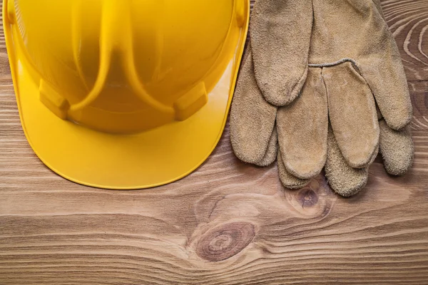 Protective gloves and building helmet — Stock Photo, Image