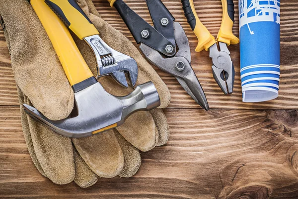 Safety gloves, hammer and adjustable wrench — Stock Photo, Image