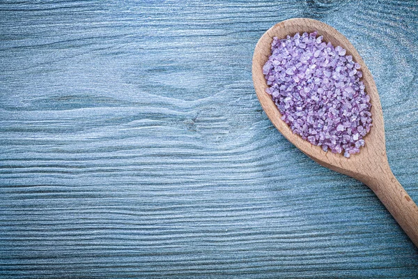 Lavender mineral sea salt for relaxation in wooden spoon on wood — Stock Photo, Image