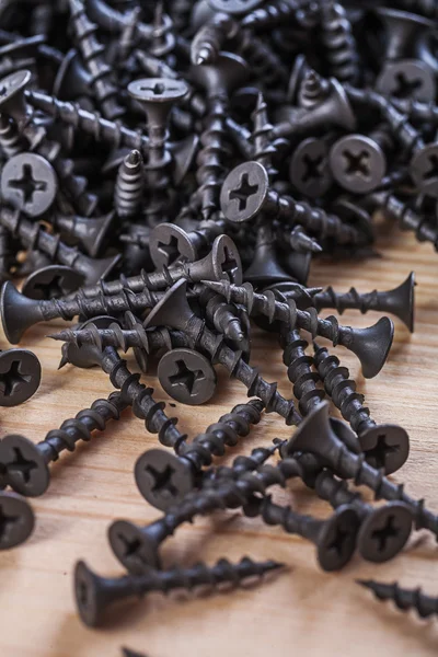 Black screws for fixation of woods — Stock Photo, Image