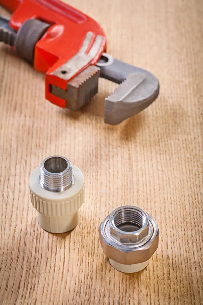 Plumbing fixtures and monkey wrench — Stock Photo, Image