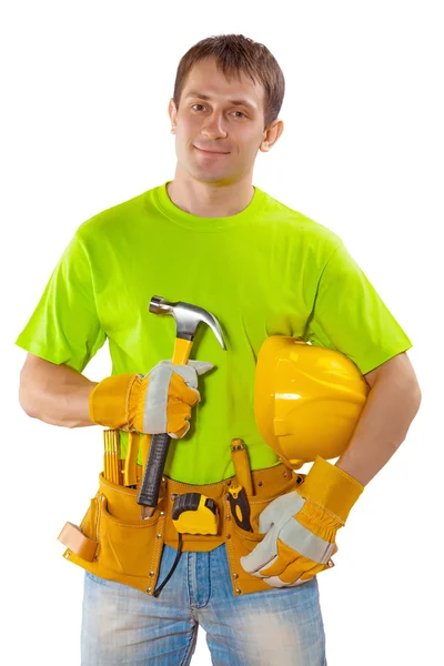 A young handsome construction contractor with tools standing hol — Stock Photo, Image