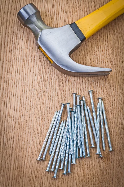 Stack of nails and claw hammer — Stock Photo, Image