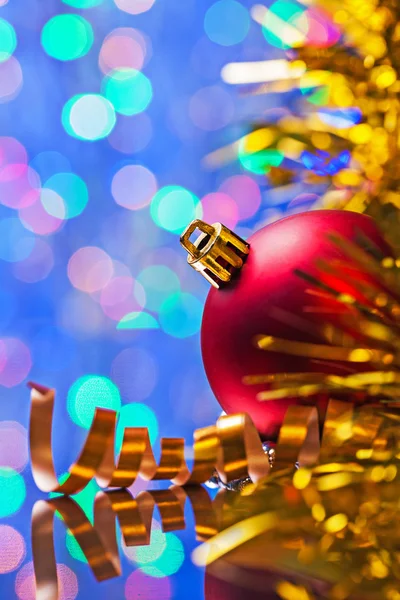 Red bauble and tinsel — Stock Photo, Image