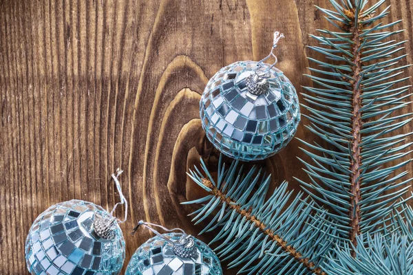 Disco balls and branch of pinetree — Stock Photo, Image