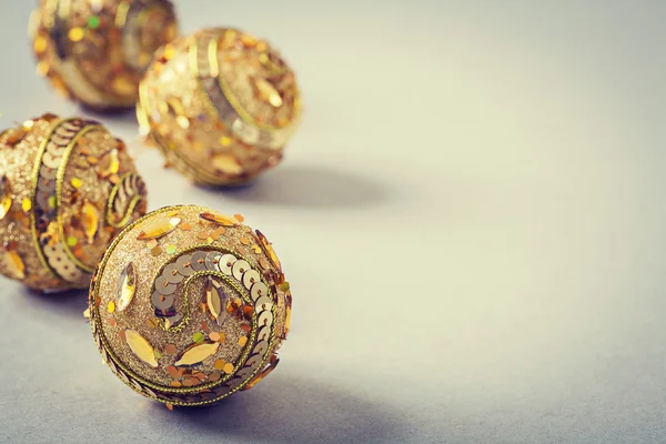 Golden christmas baubles — Stock Photo, Image