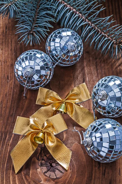 Golden christmas bows and disco balls — Stock Photo, Image