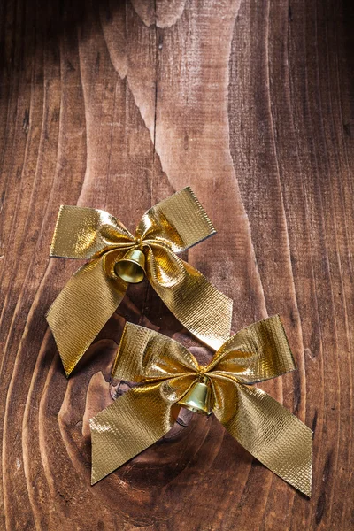 Golden bows with small bells — Stock Photo, Image