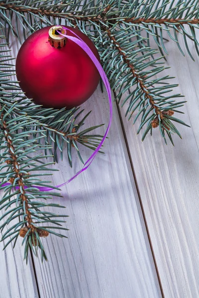 Christmas ball and pinetree branch — Stock Photo, Image