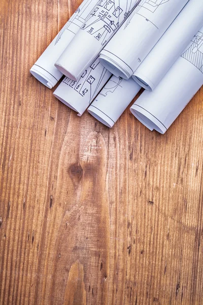 Blueprints on  wooden board — Stock Photo, Image