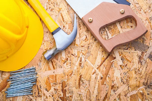 Handsaw claw hammer and nails — Stock Photo, Image