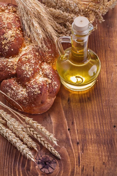 Bread and wheat with oil bottle — Stock Photo, Image