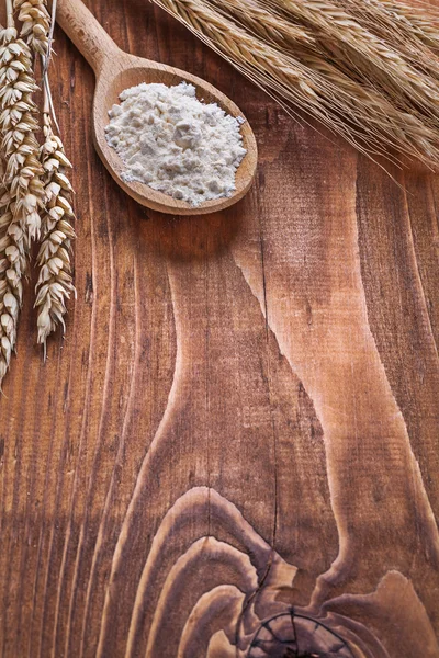 Wooden spoon with flour — Stock Photo, Image