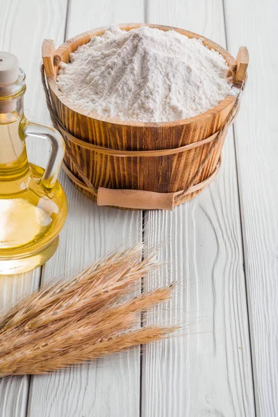 Bucket with flour, ears of wheat — Stock Photo, Image