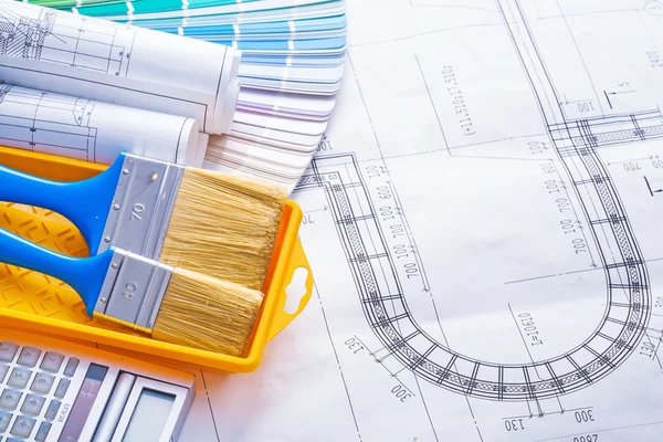 Rolled blueprints on pallete — Stock Photo, Image