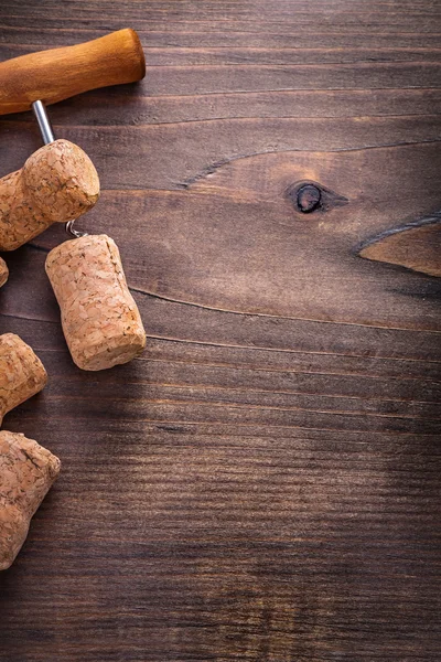 Corks of champagne and corkscrew — Stock Photo, Image