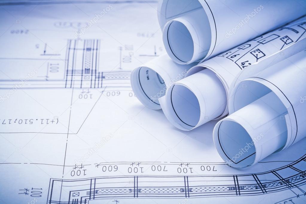 Stack of white construction blueprints