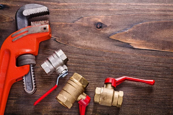 Plumbers fixtures and monkey wrench — Stock Photo, Image