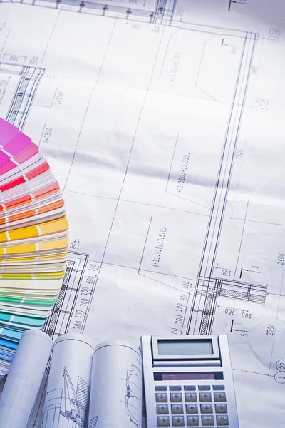 Rolled up white blueprints color palette — Stock Photo, Image