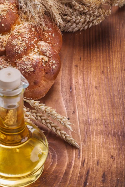 Bread bottle of oil wheat ears — Stock Photo, Image
