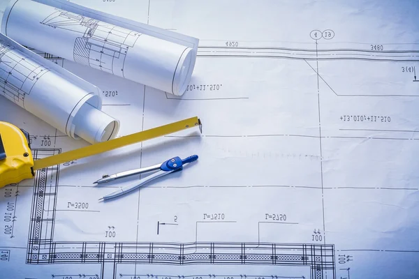 Two rolled blueprints tapeline — Stock Photo, Image