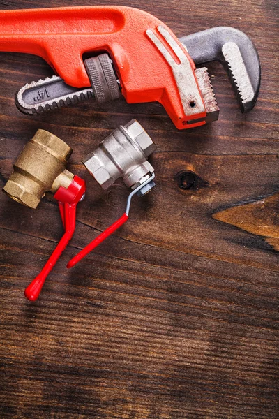 Two plumbers fixtures and monkey wrench — Stock Photo, Image