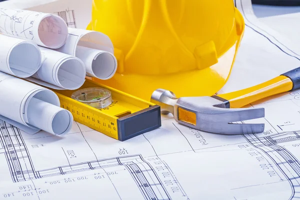 Construction tools, blueprints and helmet — Stock Photo, Image